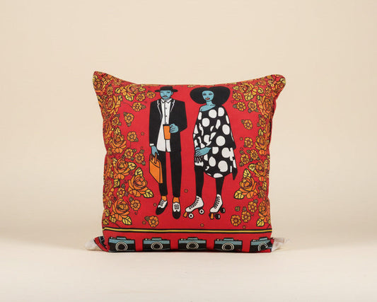 Decorative pillow of a couple on a red surface